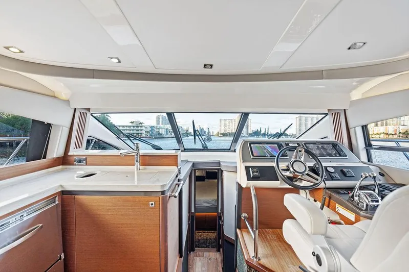  Yacht Photos Pics Interior of 2015 Sea Ray 510 Fly yacht with modern helm and kitchen area.