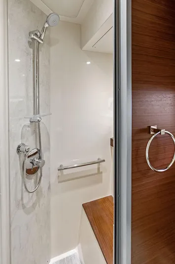  Yacht Photos Pics Shower area in 2015 Sea Ray 510 Fly yacht with modern fixtures and wooden accents.