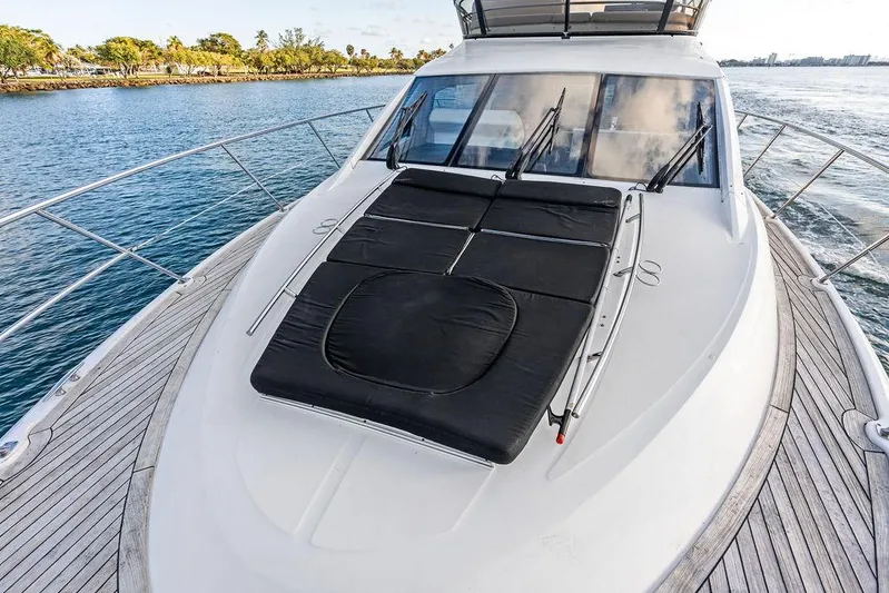  Yacht Photos Pics 2015 Sea Ray 510 Fly yacht with sunpad, cruising on calm waters.