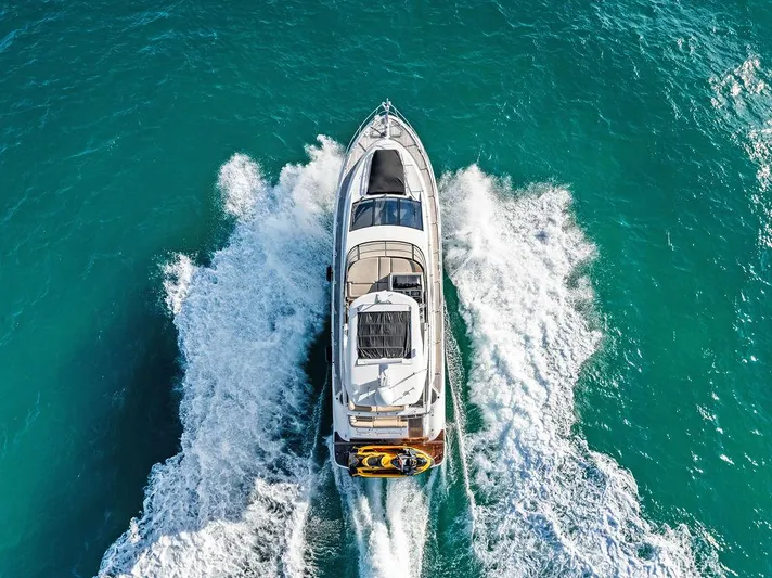  Yacht Photos Pics 2015 Sea Ray 510 Fly yacht cruising on turquoise waters, aerial view.