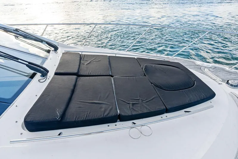  Yacht Photos Pics Sunpad on 2015 Sea Ray 510 Fly yacht, overlooking serene water.