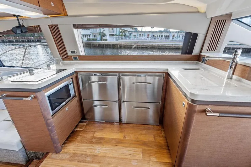  Yacht Photos Pics Luxurious kitchen interior of 2015 Sea Ray 510 Fly yacht with modern appliances.