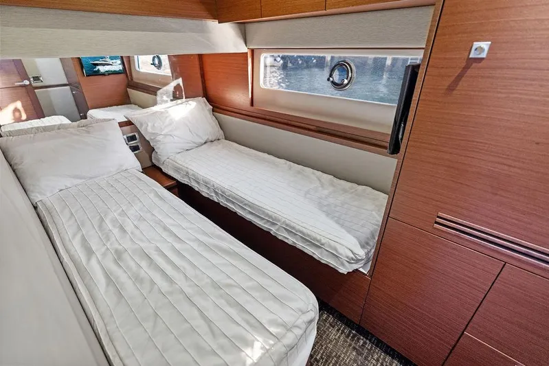  Yacht Photos Pics 2015 Sea Ray 510 Fly cabin with twin beds and modern wood finish.