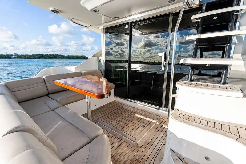  Yacht Photos Pics Luxurious 2015 Sea Ray 510 Fly yacht with elegant outdoor seating and scenic ocean view.