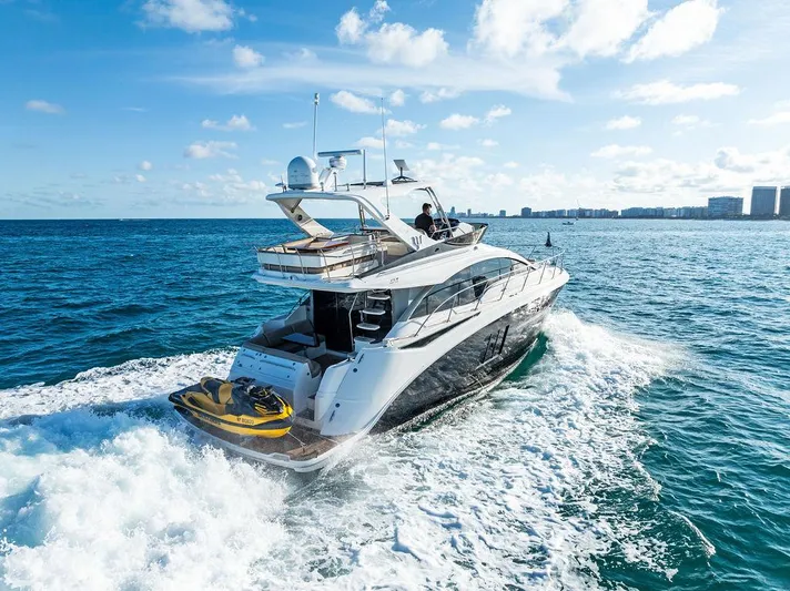  Yacht Photos Pics 2015 Sea Ray 510 Fly yacht cruising on open water under a clear sky.