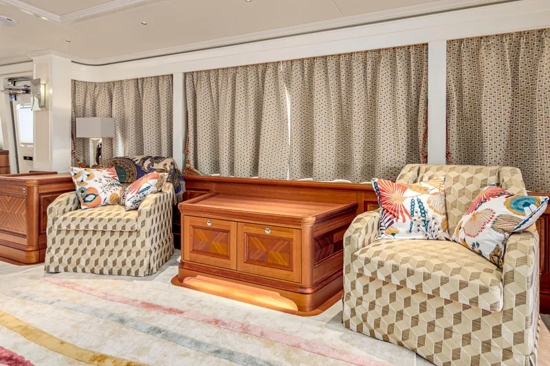 Frivolous Yacht Photos Pics Luxurious 2019 Hunt Yachts motor yacht interior with patterned chairs and elegant wooden table.