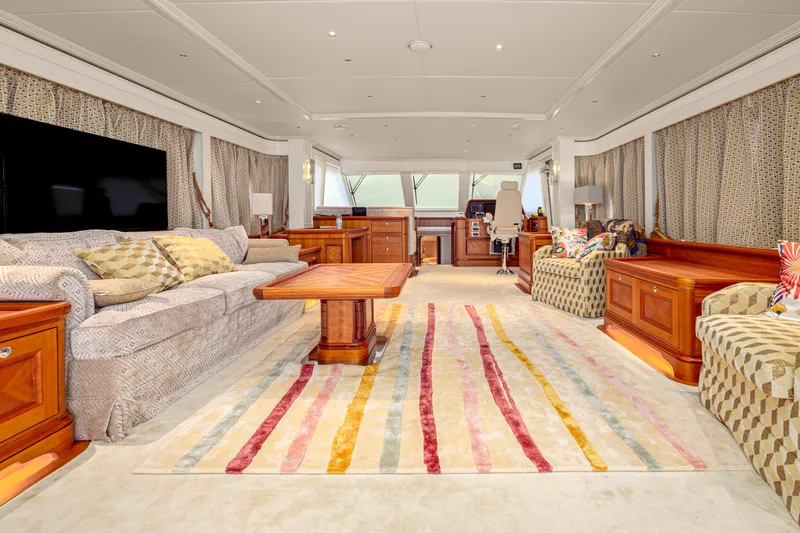 Frivolous Yacht Photos Pics Luxurious 2019 Hunt Yachts motor yacht interior with elegant furnishings and vibrant striped rug.