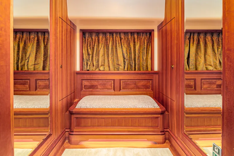 Frivolous Yacht Photos Pics Luxurious wooden interior of 2019 Hunt Yachts motor yacht cabin with elegant curtains.