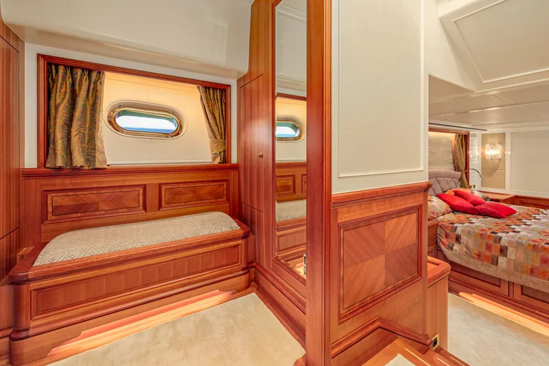 Frivolous Yacht Photos Pics Luxurious 2019 Hunt Yachts motor yacht cabin with elegant wood paneling and cozy bedding.