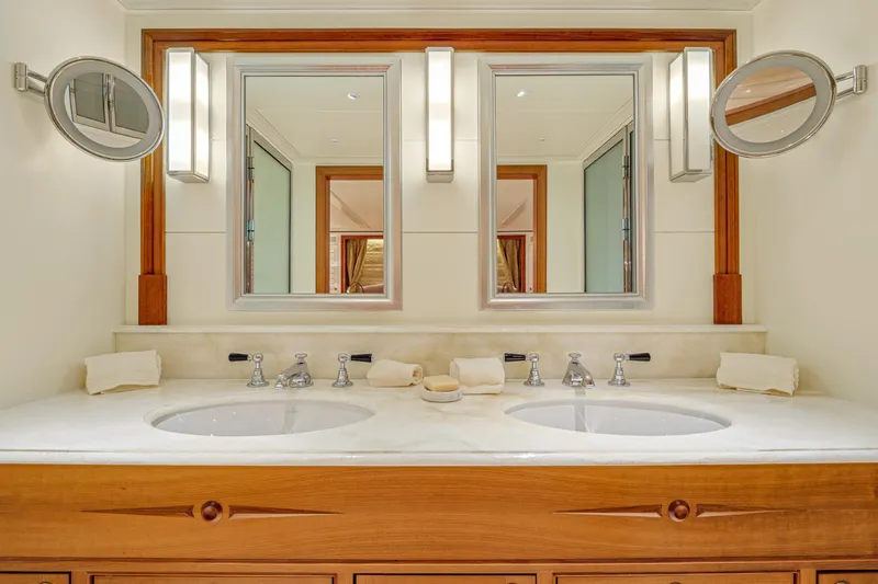 Frivolous Yacht Photos Pics Luxurious 2019 Hunt Yachts motor yacht bathroom with dual sinks and elegant mirrors.