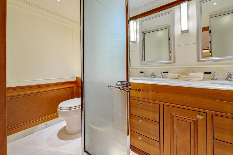 Frivolous Yacht Photos Pics Luxurious 2019 Hunt Yachts motor yacht bathroom with elegant wood cabinetry and modern fixtures.