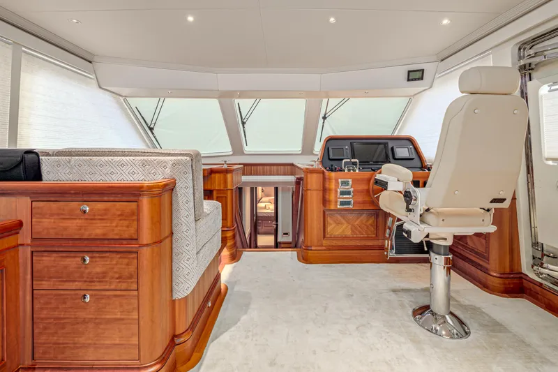 Frivolous Yacht Photos Pics Luxurious 2019 Hunt Yachts motor yacht interior with elegant wood finishes and modern helm.