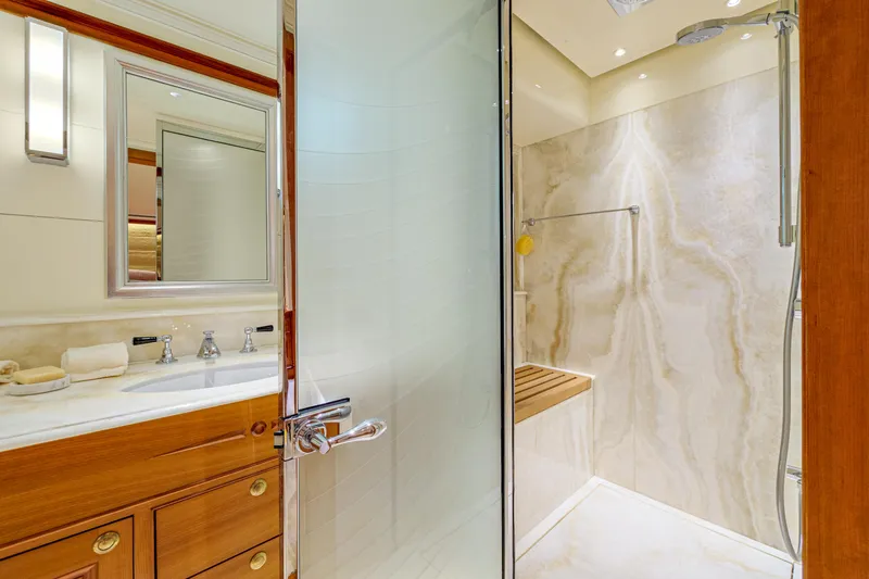 Frivolous Yacht Photos Pics Luxurious bathroom in 2019 Hunt Yachts motor yacht with marble shower and wooden cabinetry.