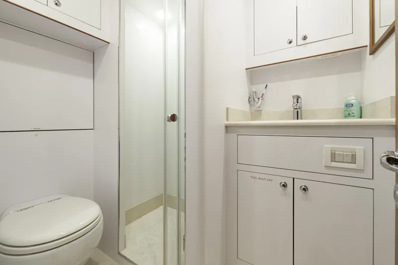 Frivolous Yacht Photos Pics Modern bathroom in 2019 Hunt Yachts motor yacht, featuring shower, toilet, and sink.