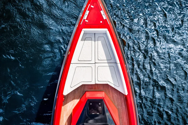 Corso Red Yacht Photos Pics Top view of a 2021 Wally 48ft boat with red and white deck on water.