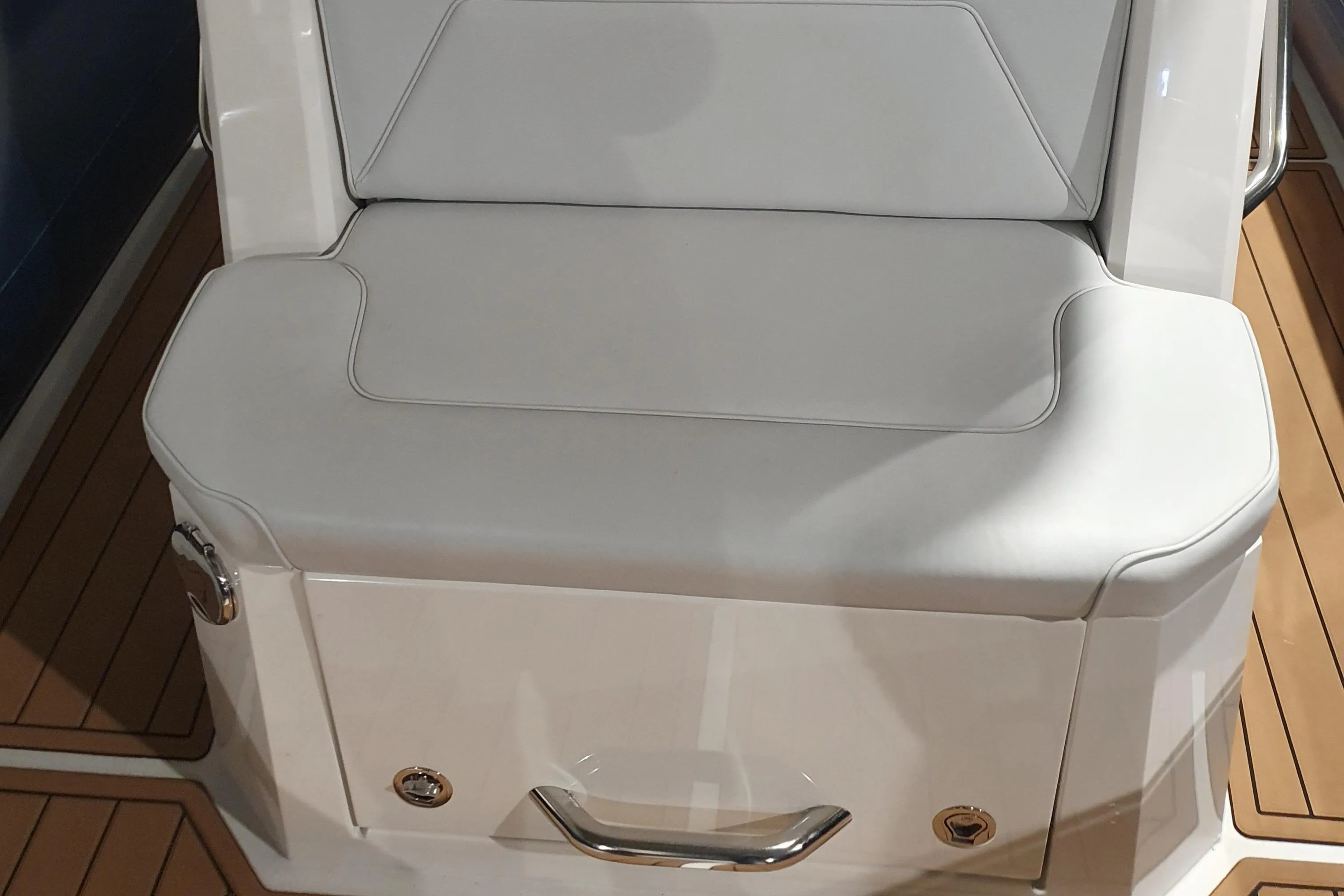 Luxury seating on 2023 Protector 330 boat with sleek white upholstery.