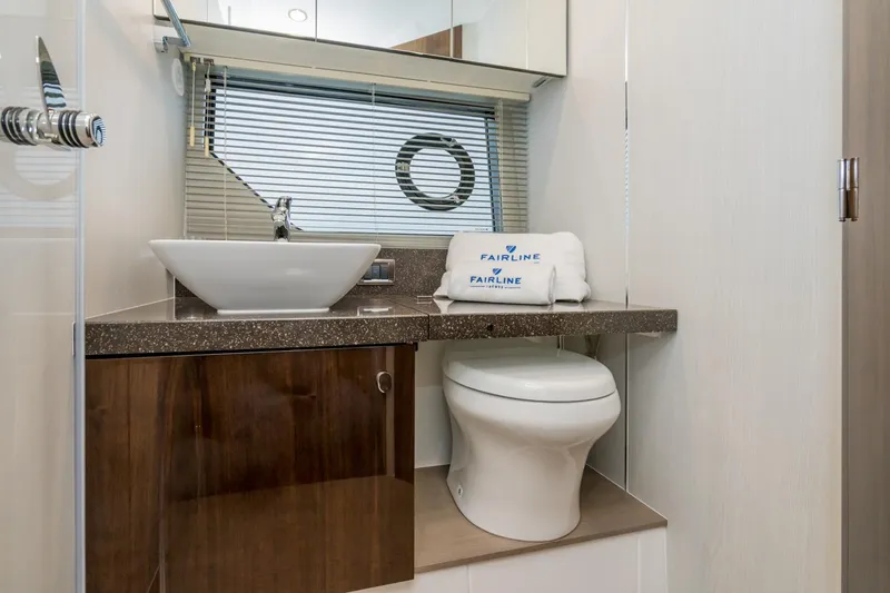  Yacht Photos Pics Luxury bathroom in 2025 Fairline Squadron 50 yacht with modern fixtures and elegant design.