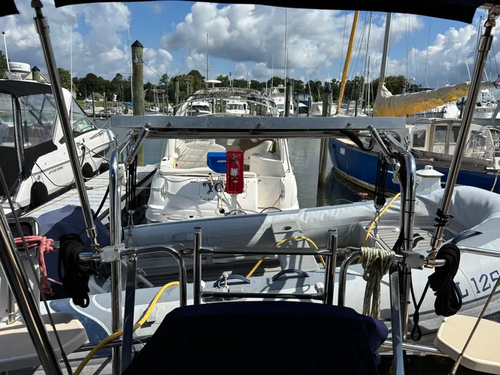 Enabled Yacht Photos Pics Marina view from 1999 Island Packet 350 sailboat, surrounded by other boats under a cloudy sky.