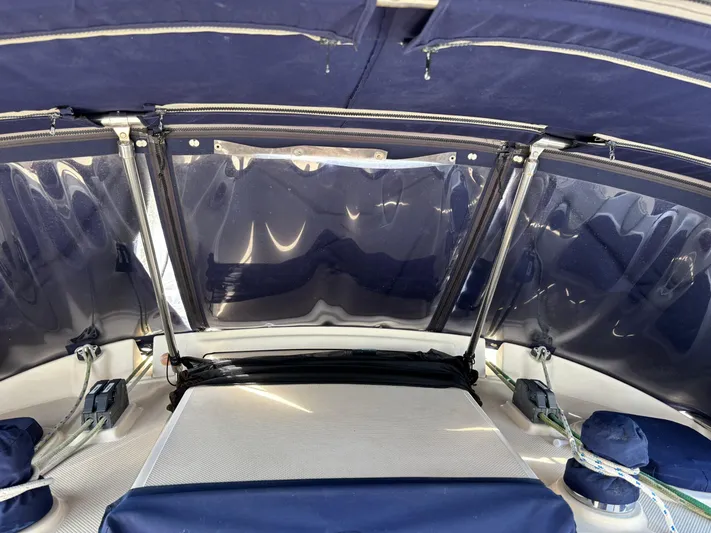 Enabled Yacht Photos Pics 1999 Island Packet 350 sailboat cockpit with blue canopy and ropes.