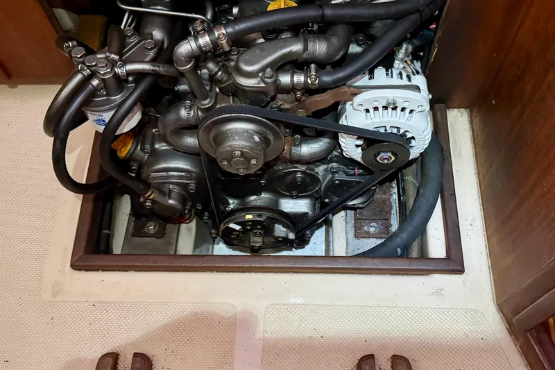 Enabled Yacht Photos Pics Engine compartment of a 1999 Island Packet 350 sailboat, showcasing mechanical components.