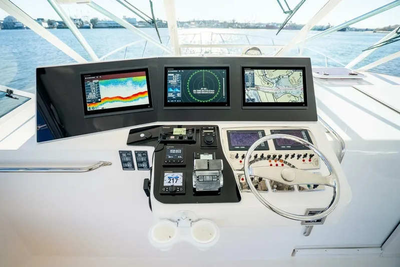 Moondawg Yacht Photos Pics Helm of 2007 Cabo 40 Express yacht with advanced navigation displays and controls.