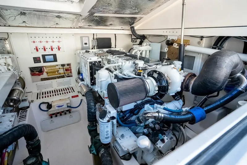 Moondawg Yacht Photos Pics Engine room of 2007 Cabo 40 Express boat, showcasing detailed mechanical components.