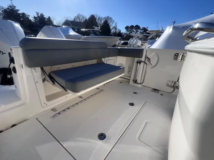  Yacht Photos Pics 2022 Boston Whaler 280 Outrage boat interior with seating and deck details.