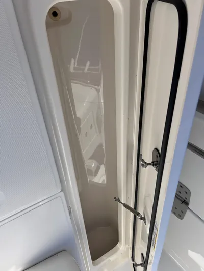  Yacht Photos Pics 2022 Boston Whaler 280 Outrage storage compartment interior view.