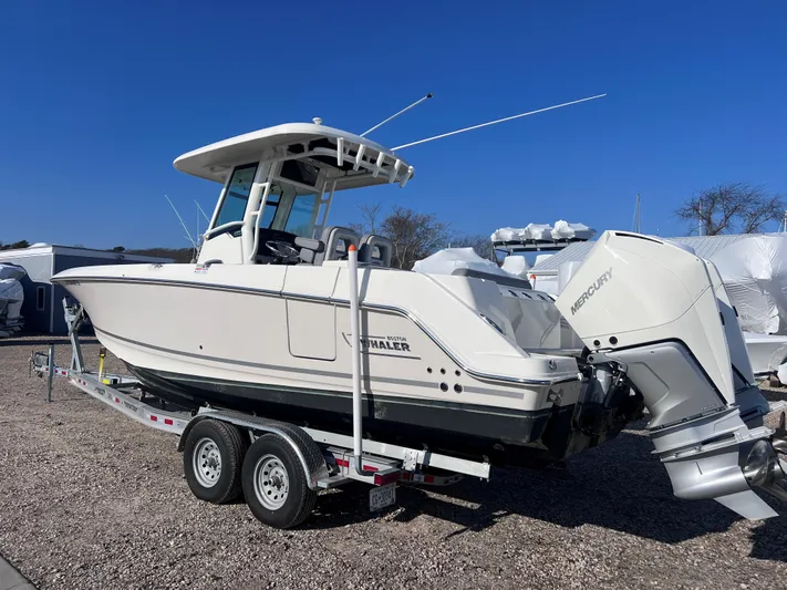  Yacht Photos Pics 2022 Boston Whaler 280 Outrage boat on trailer, side view.