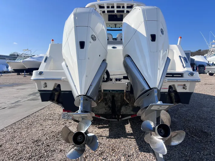  Yacht Photos Pics 2022 Boston Whaler 280 Outrage with dual outboard engines, rear view.