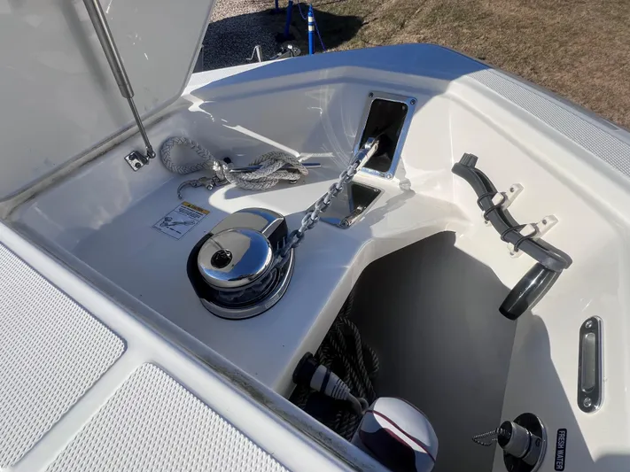  Yacht Photos Pics Anchor compartment of 2022 Boston Whaler 280 Outrage boat, featuring winch and storage.