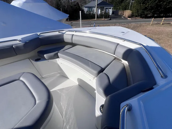  Yacht Photos Pics 2022 Boston Whaler 280 Outrage boat interior with gray seating and spacious layout.