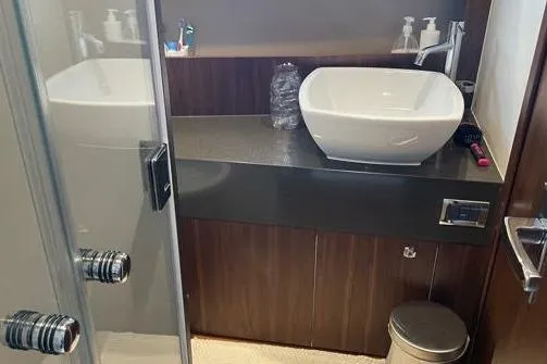  Yacht Photos Pics Luxurious bathroom in 2015 Fairline SQUADRON 67 yacht with modern sink and sleek design.