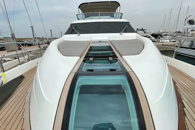  Yacht Photos Pics 2015 Fairline SQUADRON 67 yacht with sleek design and glass deck, docked at marina.