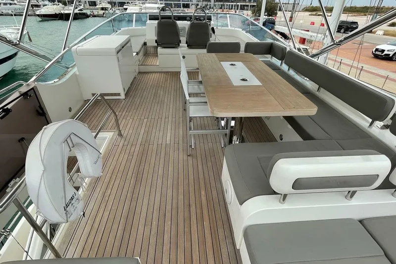  Yacht Photos Pics Luxurious 2015 Fairline SQUADRON 67 yacht deck with seating and dining area.