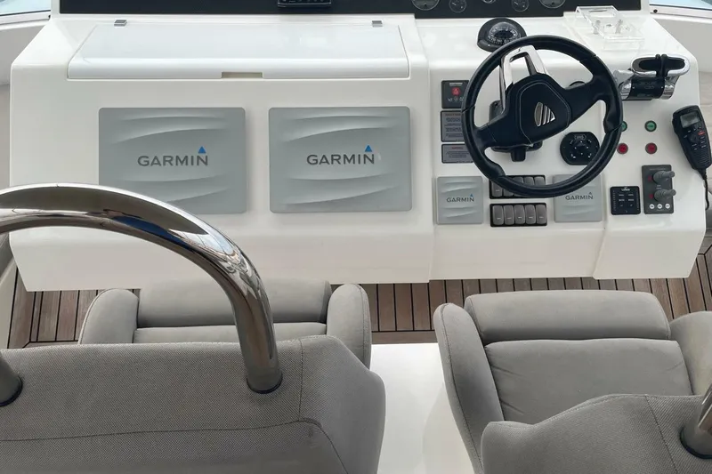  Yacht Photos Pics Cockpit of 2015 Fairline Squadron 67 yacht with Garmin navigation systems.