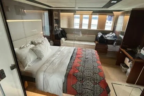  Yacht Photos Pics Luxurious bedroom interior of 2015 Fairline SQUADRON 67 yacht with elegant decor.