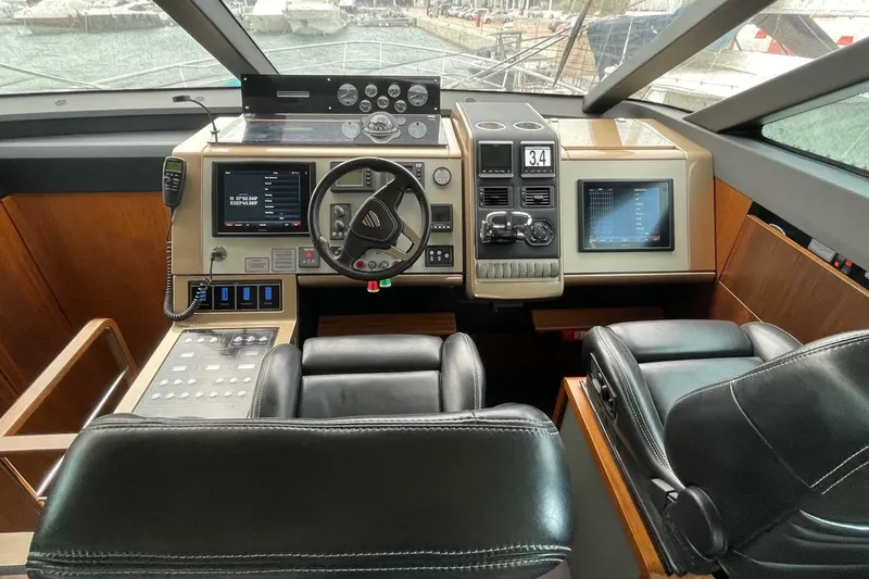 Yacht Photos Pics Cockpit of 2015 Fairline Squadron 67 yacht with modern navigation equipment.