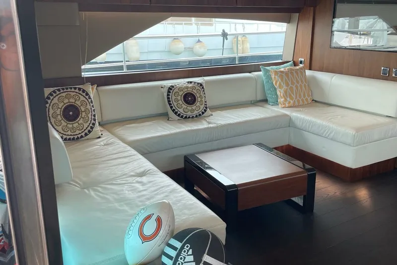  Yacht Photos Pics Luxurious interior of 2015 Fairline SQUADRON 67 yacht with elegant white seating and decorative pillows.