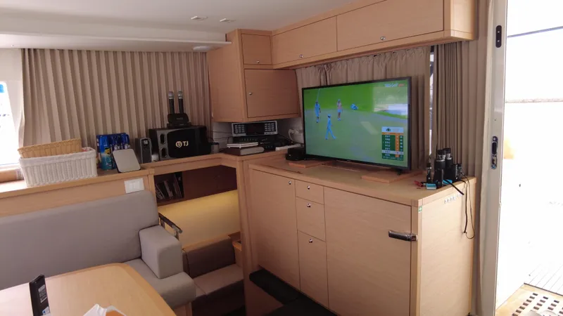  Yacht Photos Pics Luxurious interior of 2019 Lagoon 450S yacht with TV and modern amenities.