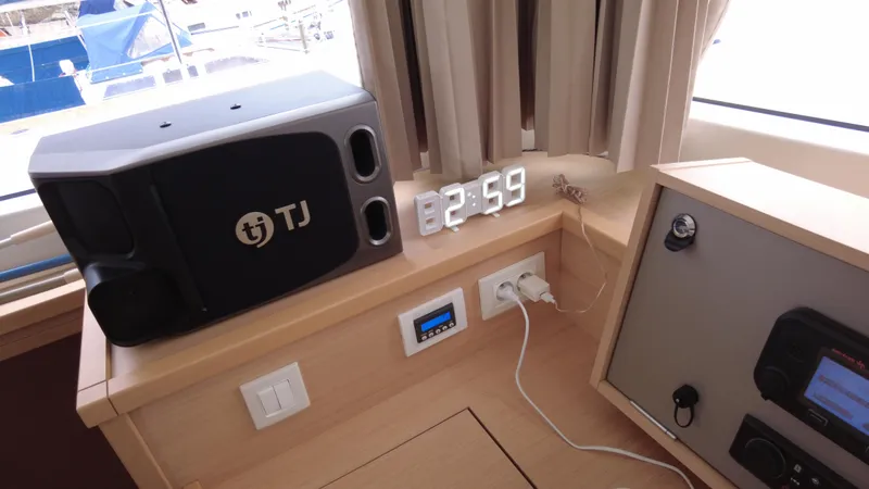  Yacht Photos Pics Interior of 2019 Lagoon 450S yacht with speaker, digital clock, and control panel.