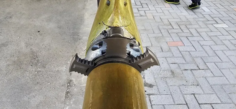  Yacht Photos Pics Close-up of a Lagoon 450S 2019 boat propeller shaft on a paved surface.