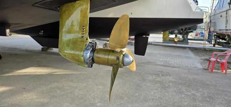  Yacht Photos Pics Propeller of 2019 Lagoon 450S catamaran on dry dock, showcasing marine engineering.