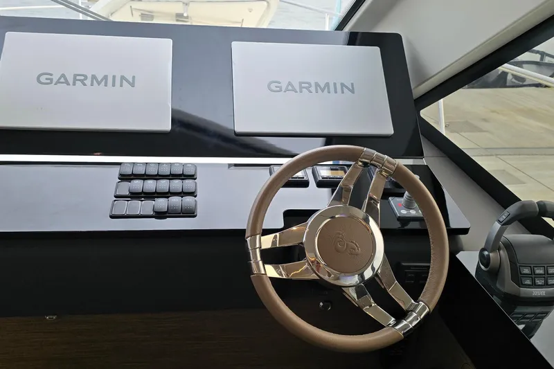  Yacht Photos Pics Steering wheel and Garmin displays on 2022 Monte Carlo MC52 yacht dashboard.