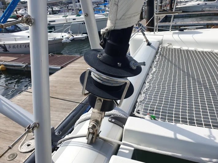  Yacht Photos Pics 2019 Lagoon 450S sailboat deck with rigging and marina background.