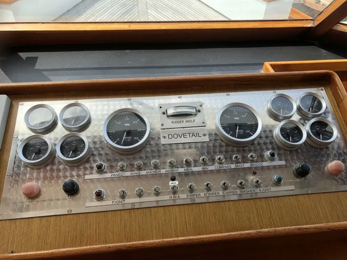Dovetail Yacht Photos Pics Control panel of a 1972 Trumpy 72 Houseboat with various gauges and switches.