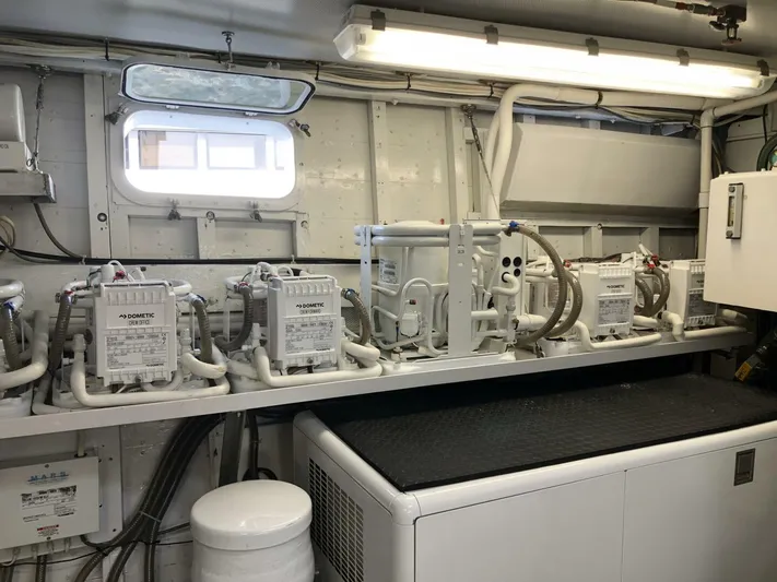 Dovetail Yacht Photos Pics Engine room of a 1972 Trumpy 72 Houseboat with Dometic equipment.