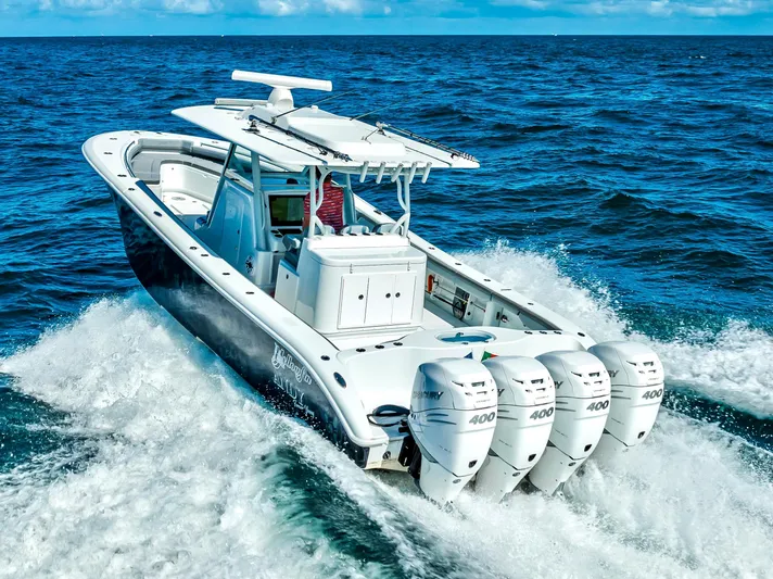  Yacht Photos Pics 2021 Yellowfin 39 boat cruising on open ocean with four powerful engines.