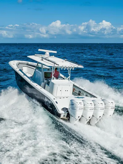  Yacht Photos Pics 2021 Yellowfin 39 boat cruising on open ocean with four powerful engines.