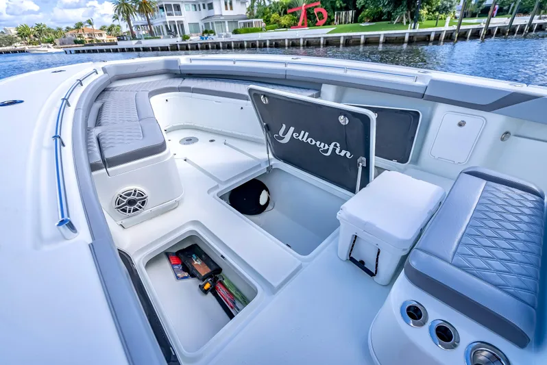  Yacht Photos Pics 2021 Yellowfin 39 boat interior with storage compartments and seating.